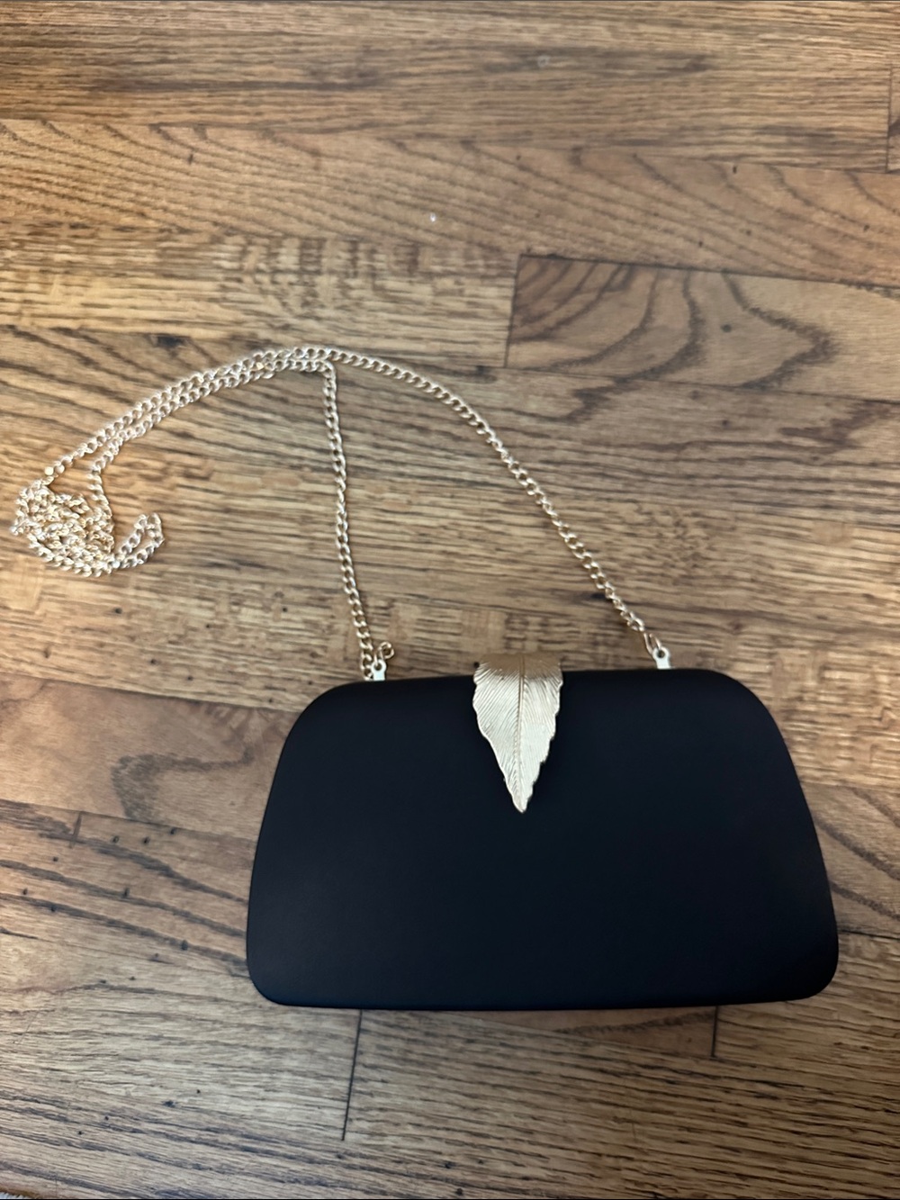 Elegant Black Satin Clutch with Gold Leaf Accent and Chain